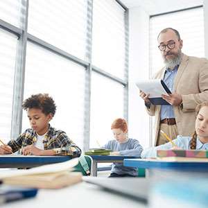 Student reading book in library wearing mask
